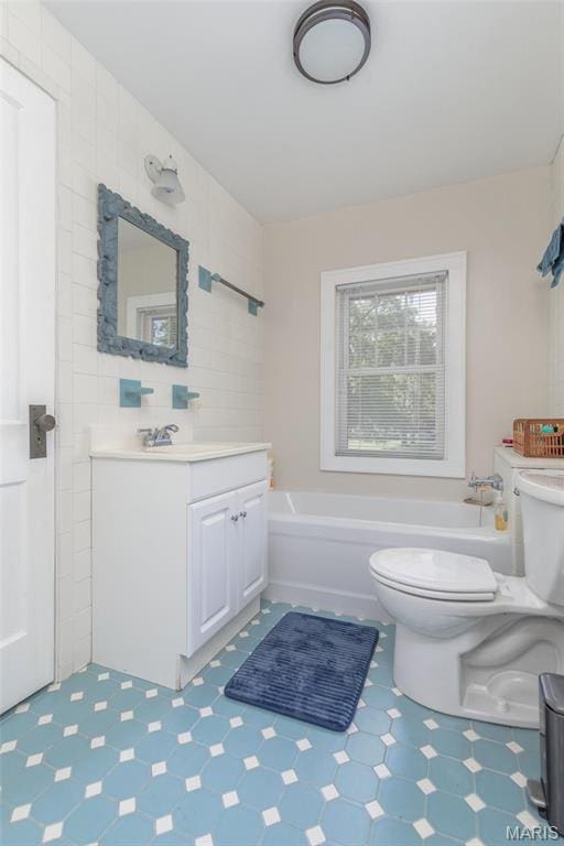 721 Taylor Ave, Godfrey, IL 62035 - full bathroom with a tub to relax in, toilet, tile patterned floors, and vanity
