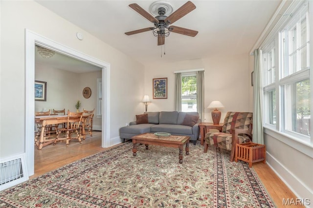 721 Taylor Ave, Godfrey, IL 62035 - living room with light wood finished floors, ceiling fan, and baseboards