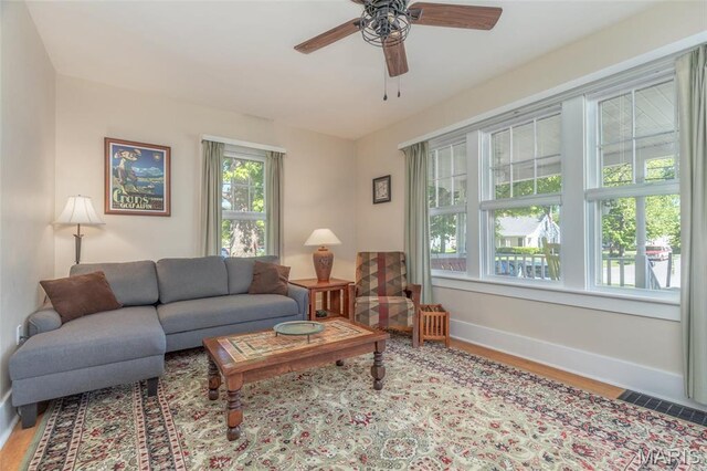 721 Taylor Ave, Godfrey, IL 62035 - living room with baseboards, wood finished floors, and ceiling fan