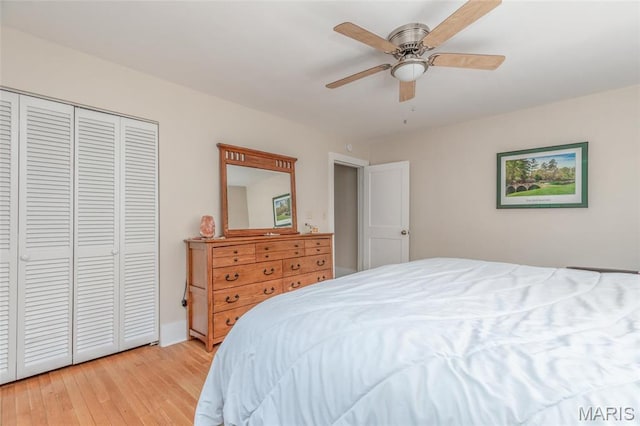 721 Taylor Ave, Godfrey, IL 62035 - bedroom featuring light wood finished floors, a closet, and ceiling fan