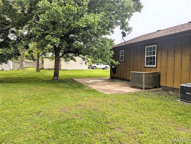 631 W Victor St, Poplar Bluff, MO 63901 - view of green lawn with a patio and cooling unit
