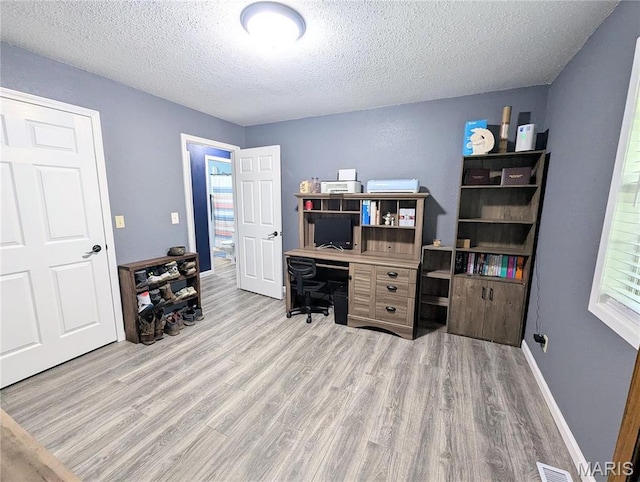 631 W Victor St, Poplar Bluff, MO 63901 - office area with wood finished floors, a textured ceiling, and baseboards