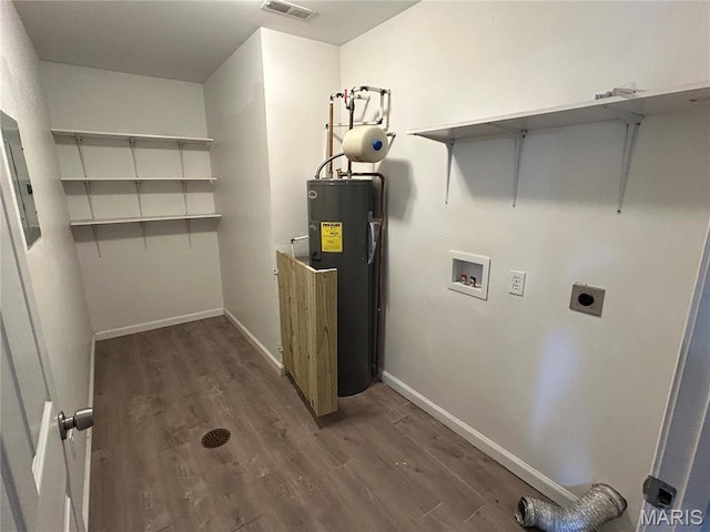 washroom featuring water heater, hookup for an electric dryer, washer hookup, wood finished floors, and baseboards