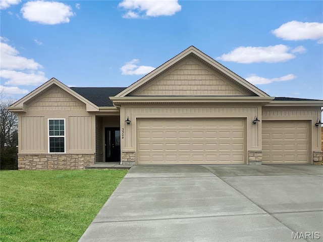 3304 Nat View Ct, Washington, MO 63090 - view of front of property featuring stone siding, concrete driveway, a garage, a front lawn, and board and batten siding