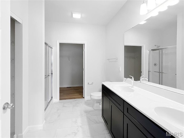 3304 Nat View Ct, Washington, MO 63090 - bathroom with a spacious closet, a stall shower, marble finish floors, and double vanity
