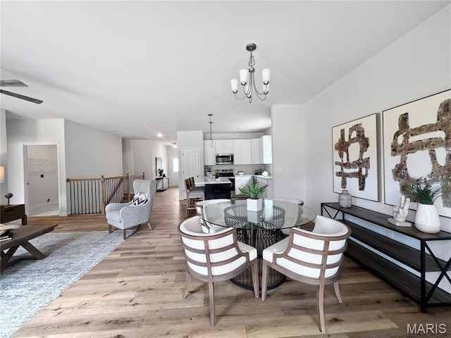 3304 Nat View Ct, Washington, MO 63090 - dining room featuring a chandelier, light wood finished floors, and ceiling fan