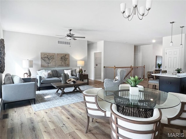 3304 Nat View Ct, Washington, MO 63090 - dining space featuring ceiling fan, light wood finished floors, and a chandelier