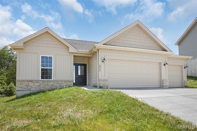 3304 Nat View Ct, Washington, MO 63090 - view of front of house featuring stone siding, an attached garage, driveway, a front yard, and board and batten siding