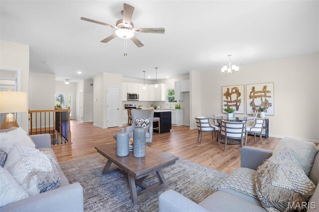 3304 Nat View Ct, Washington, MO 63090 - living area featuring a chandelier, light wood-style floors, ceiling fan, and recessed lighting