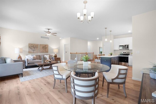 3304 Nat View Ct, Washington, MO 63090 - dining area with recessed lighting, light wood finished floors, a ceiling fan, and a chandelier