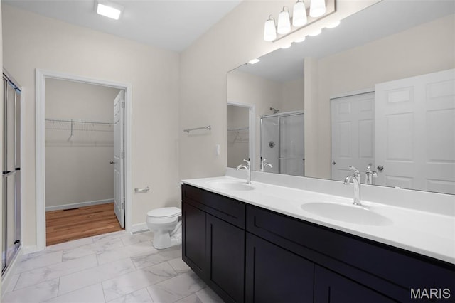 3304 Nat View Ct, Washington, MO 63090 - full bath with a shower stall, marble look tile flooring, a walk in closet, and double vanity