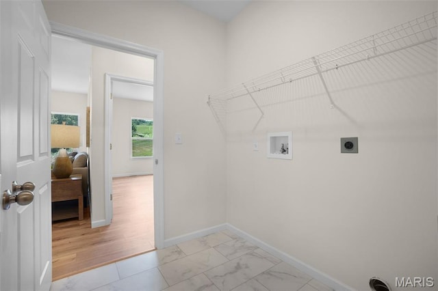 3304 Nat View Ct, Washington, MO 63090 - laundry room featuring electric dryer hookup, washer hookup, and light marble finish floors
