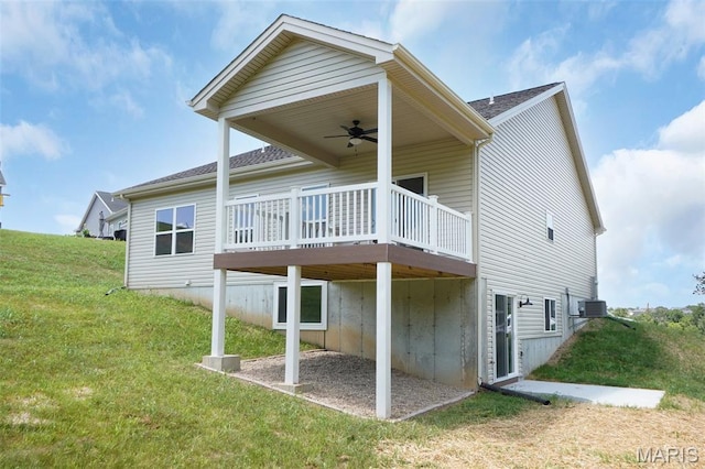 3304 Nat View Ct, Washington, MO 63090 - back of property with ceiling fan, a deck, a yard, and roof with shingles