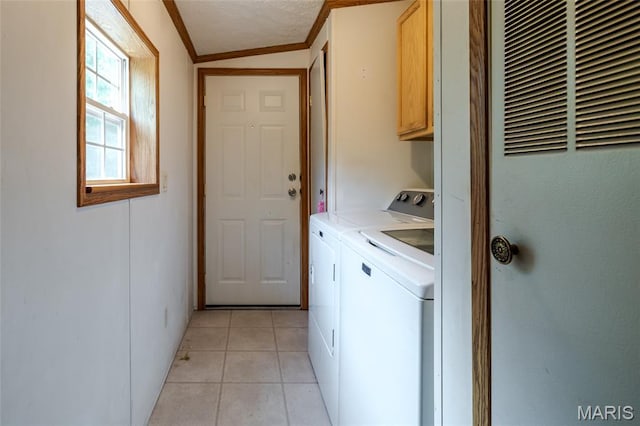 24 Clonts Rd, Sullivan, MO 63080 - laundry area featuring a heating unit, cabinet space, ornamental molding, washer and clothes dryer, and light tile patterned floors
