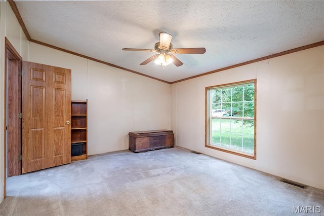 24 Clonts Rd, Sullivan, MO 63080 - carpeted empty room with crown molding, lofted ceiling, ceiling fan, and a textured ceiling
