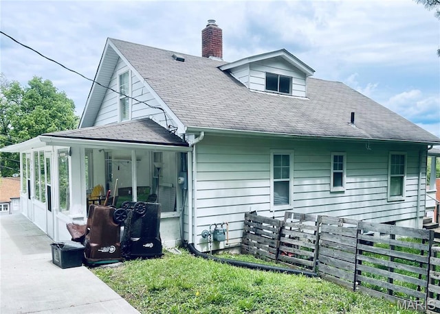 219 2nd St, Winfield, MO 63389 - rear view of property featuring fence, a porch, a chimney, and roof with shingles