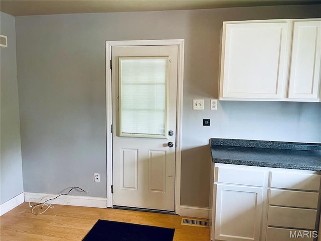 219 2nd St, Winfield, MO 63389 - entryway with wood finished floors and baseboards