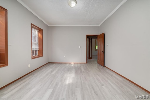 4210 E Carter Ave, Saint Louis, MO 63115 - empty room with light wood-style flooring, crown molding, a textured ceiling, and baseboards
