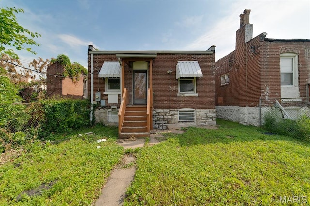 4210 E Carter Ave, Saint Louis, MO 63115 - view of front facade with brick siding and entry steps