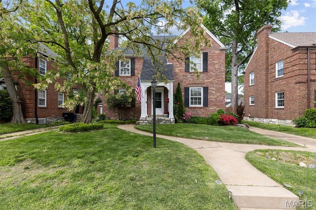 7487 Shaftesbury Ave, University City, MO 63130 - view of front of home with a front yard and brick siding