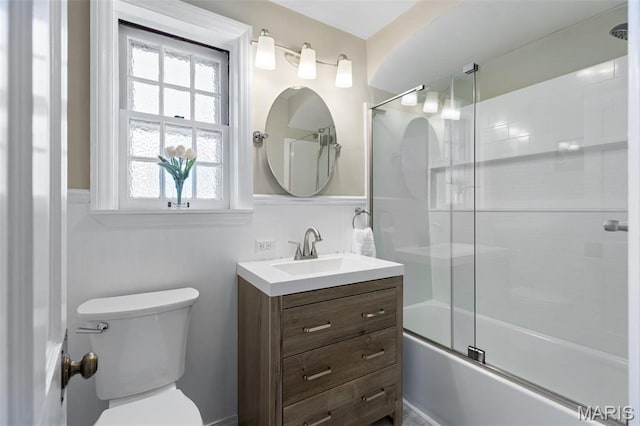 7487 Shaftesbury Ave, University City, MO 63130 - full bath with wainscoting, toilet, vanity, and combined bath / shower with glass door