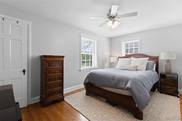 7487 Shaftesbury Ave, University City, MO 63130 - bedroom featuring light wood-style floors, baseboards, and ceiling fan