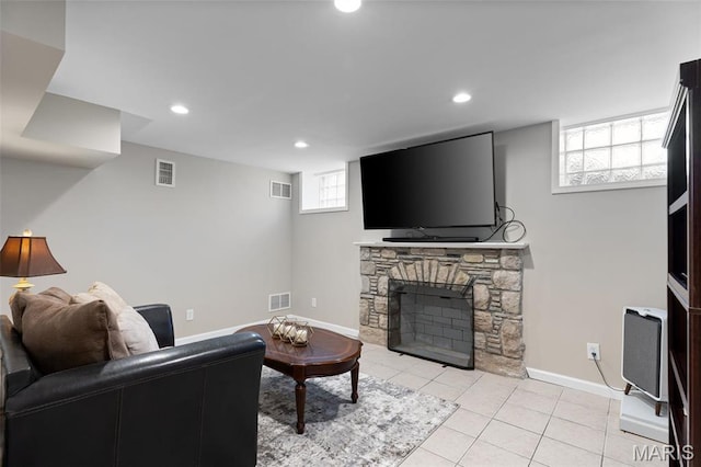 7487 Shaftesbury Ave, University City, MO 63130 - living room with a fireplace, recessed lighting, baseboards, and light tile patterned flooring