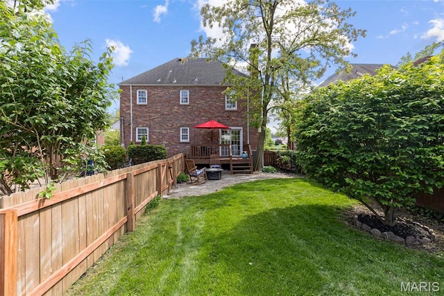 7487 Shaftesbury Ave, University City, MO 63130 - back of house with a wooden deck and brick siding