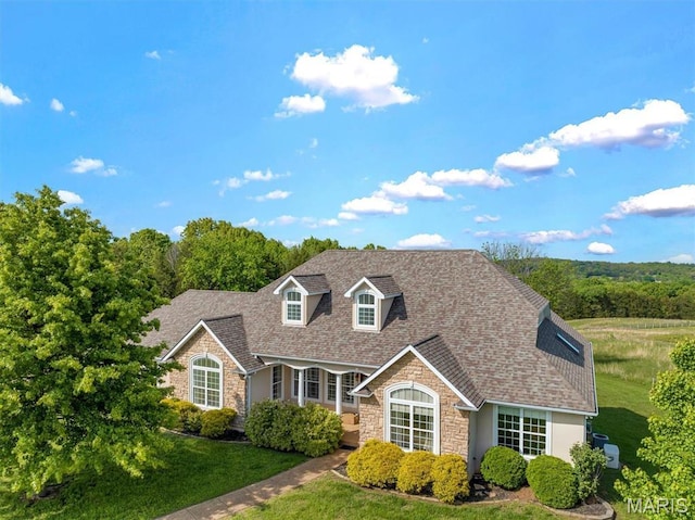 3033 Oakvale Rd, De Soto, MO 63020 - view of front facade featuring stone siding, a shingled roof, and a front yard