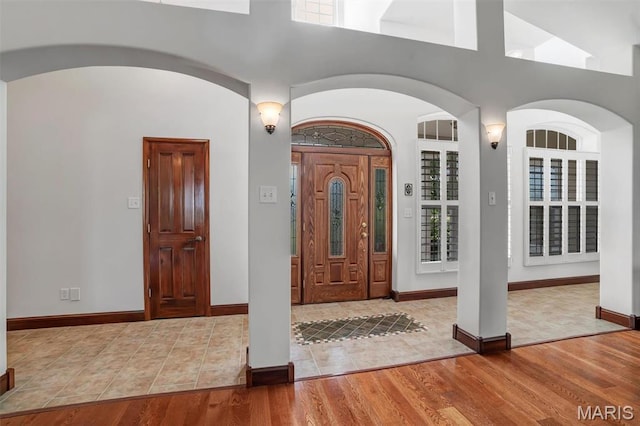 3033 Oakvale Rd, De Soto, MO 63020 - foyer entrance with arched walkways, wood finished floors, and baseboards