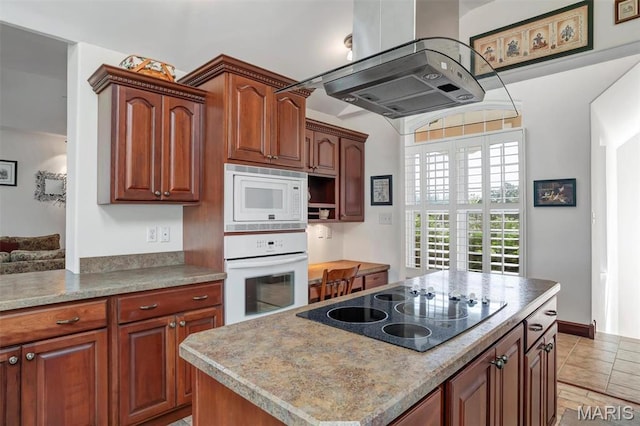 3033 Oakvale Rd, De Soto, MO 63020 - kitchen featuring white appliances, exhaust hood, a center island, and light countertops
