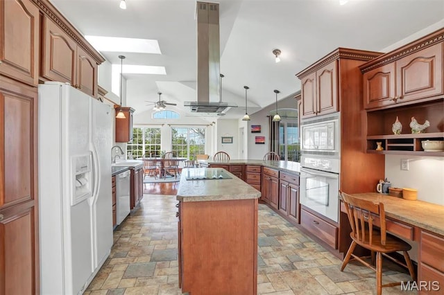 3033 Oakvale Rd, De Soto, MO 63020 - kitchen with white appliances, stone tile flooring, a peninsula, light countertops, and lofted ceiling