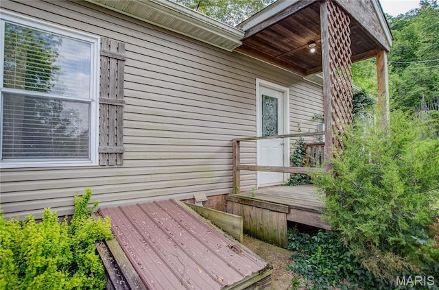 view of property exterior with a deck