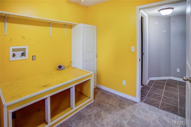 laundry area featuring washer hookup and baseboards