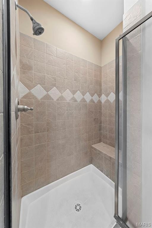 bathroom with a shower stall