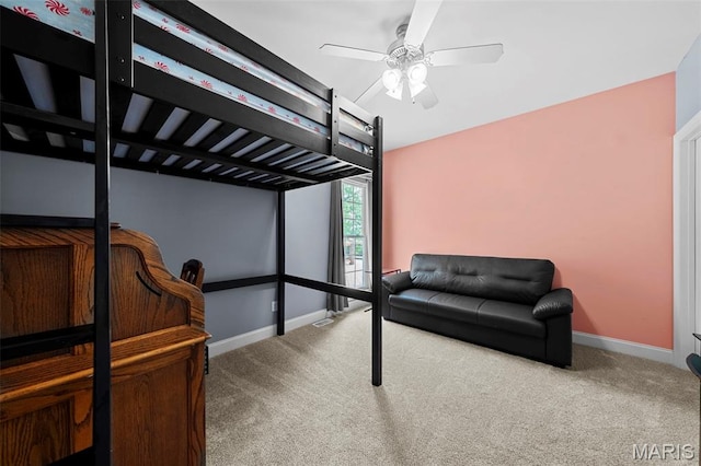bedroom featuring carpet floors, baseboards, and a ceiling fan