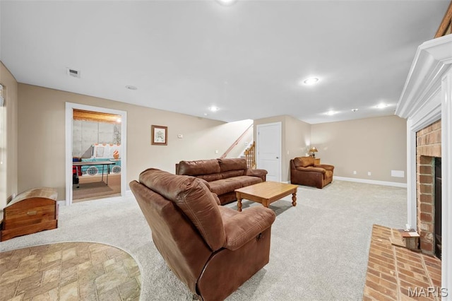 living room featuring stairs, carpet, a brick fireplace, baseboards, and recessed lighting