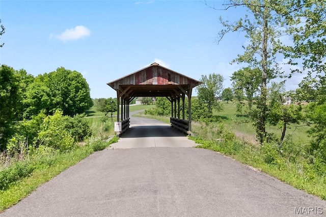 surrounding community featuring a carport and driveway