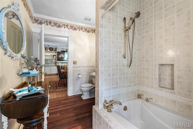 505 Thompson Ln, Arcadia, MO 63621 - full bathroom with tile walls, wood finished floors, crown molding, and tiled shower / bath combo