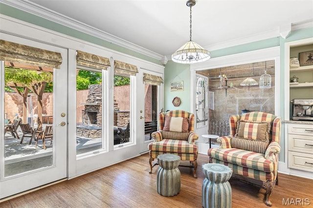505 Thompson Ln, Arcadia, MO 63621 - living area with a chandelier, crown molding, wood finished floors, and french doors
