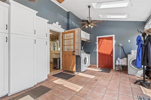505 Thompson Ln, Arcadia, MO 63621 - laundry area with cabinet space, a skylight, ceiling fan, a towering ceiling, and light tile patterned floors