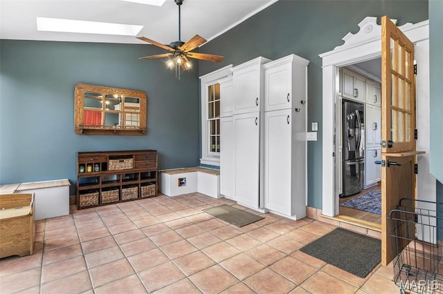 505 Thompson Ln, Arcadia, MO 63621 - interior space featuring ceiling fan, a skylight, light tile patterned floors, and vaulted ceiling