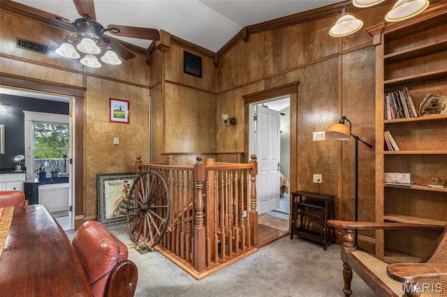 505 Thompson Ln, Arcadia, MO 63621 - sitting room featuring lofted ceiling, carpet floors, a ceiling fan, an upstairs landing, and crown molding