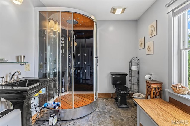 505 Thompson Ln, Arcadia, MO 63621 - bathroom featuring stone finish floors and baseboards