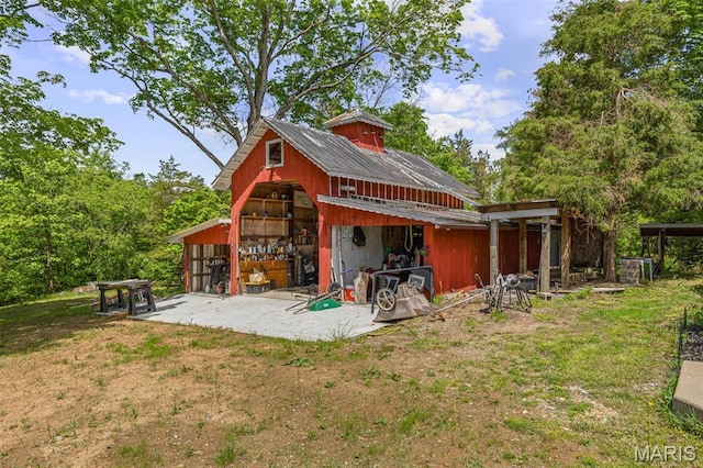 505 Thompson Ln, Arcadia, MO 63621 - back of house featuring an outbuilding and a garage
