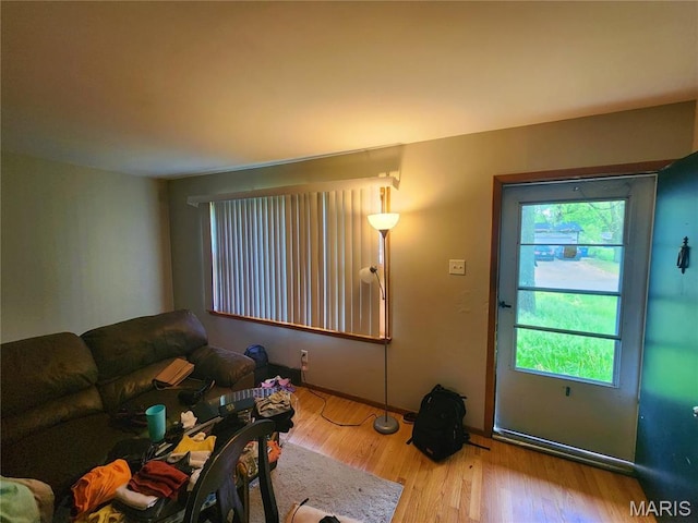 1437 Farmview Ave, Saint Louis, MO 63138 - living room with wood finished floors and baseboards