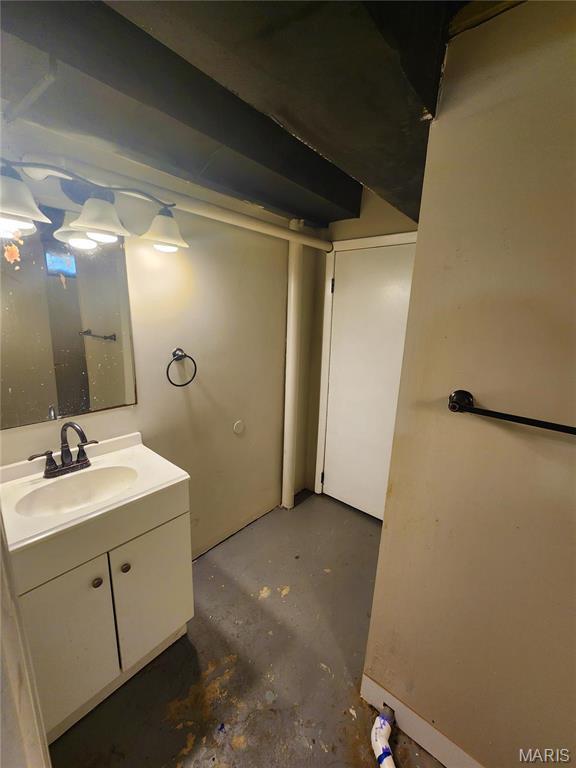 1437 Farmview Ave, Saint Louis, MO 63138 - bathroom with concrete flooring and vanity