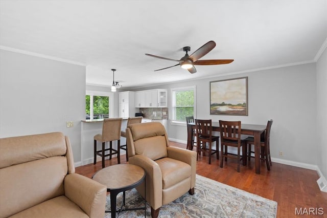8316 D Rd, Waterloo, IL 62298 - living area with plenty of natural light, ceiling fan, ornamental molding, baseboards, and wood finished floors