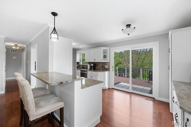 8316 D Rd, Waterloo, IL 62298 - kitchen with crown molding, a sink, a peninsula, dishwasher, and white cabinets