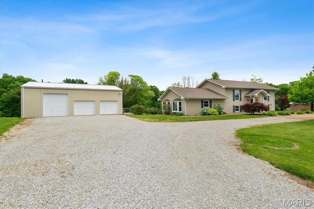 8316 D Rd, Waterloo, IL 62298 - view of front of home with a detached garage, an outbuilding, and a front yard
